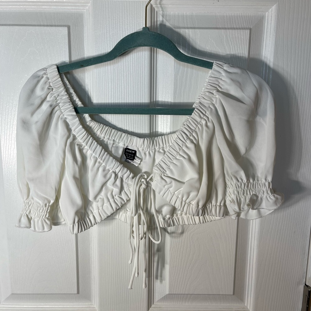 White crop shirt with a tie in the middle